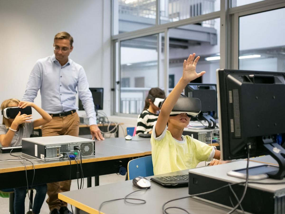 group-of-multiethnic-kids-wearing-vr-headsets-and-teacher-watching-them
